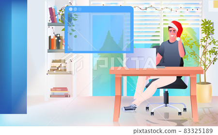 man in santa hat using laptop online communication social media network happy new year christmas holidays 83325189