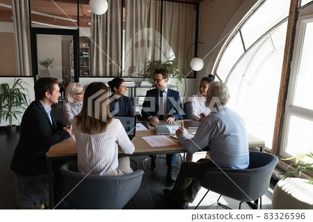 Friendly corporate business team of diverse managers gather for briefing Friendly corporate business team of diverse managers gather for briefing 83326596