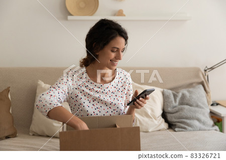 Happy consumer giving feedback to online order delivery Happy consumer giving feedback to online order delivery 83326721