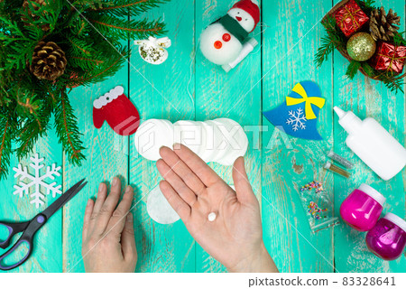Create a children's Christmas gift with a little angel toy made of cotton pads. Children's art project, handicrafts, handicrafts for children. Step-by-step instruction. Step 6 Create a children's Christmas gift with a little angel toy made of cotton pads. Children's art project, handicrafts, handicrafts for children. Step-by-step instruction. Step 6 83328641