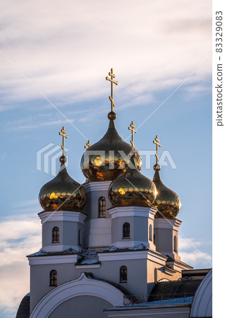 The golden domes of the Christian church in sunset light. The golden domes of the Christian church in sunset light. 83329083