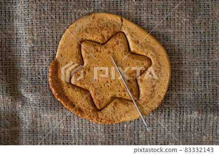 Brown sugar caramel candy cookies with a metal needle Brown sugar caramel candy cookies with a metal needle 83332143