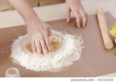 Woman Mixing Dry and Liquid Ingredeints Woman Mixing Dry and Liquid Ingredeints 83332829