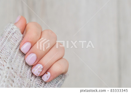 Closeup elegant pastel natural modern design manicure. Female hands. Gel nails. Nude manicure. Beige color. Skin care. Beauty. Nail care Closeup elegant pastel natural modern design manicure. Female hands. Gel nails. Nude manicure. Beige color. Skin care. Beauty. Nail care 83333345