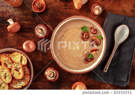 Mushroom cream soup with various mushrooms and toasted bread 83333551