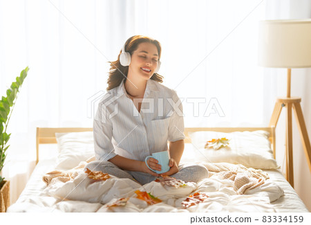 woman enjoying sunny morning woman enjoying sunny morning 83334159