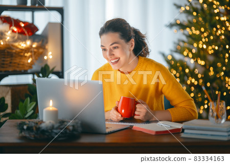 Woman working before Christmas Woman working before Christmas 83334163