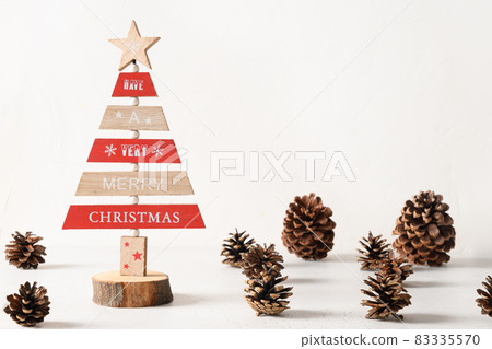 Creative wooden Eco Christmas tree and pine cones on white background. DIY. Creative wooden Eco Christmas tree and pine cones on white background. DIY. 83335570