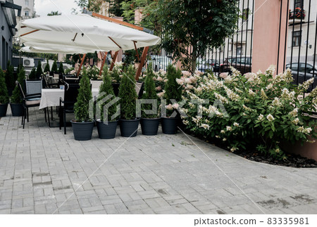 cozy street with cafe tables 83335981