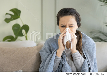 Young woman suffering from cold. 83336167