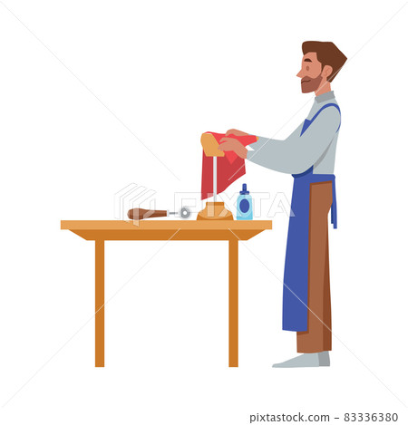 Cartoon shoe maker character, bearded smiling man enjoy leather footwear manufacturing, standing sideview near table. Cartoon shoe maker character, bearded smiling man enjoy leather footwear manufacturing, standing sideview near table. 83336380