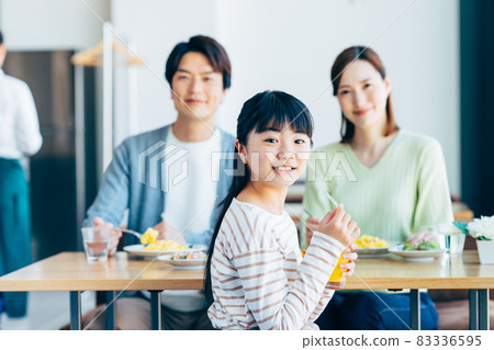 Young family having lunch at a cafe Young family having lunch at a cafe 83336595
