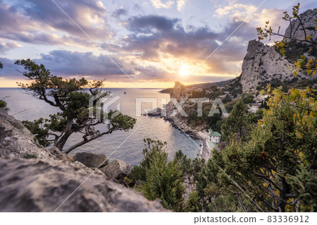 Golden sunset from Panea cliff with mountain cat koshka in background. Simeiz, Crimea. Black Sea 83336912