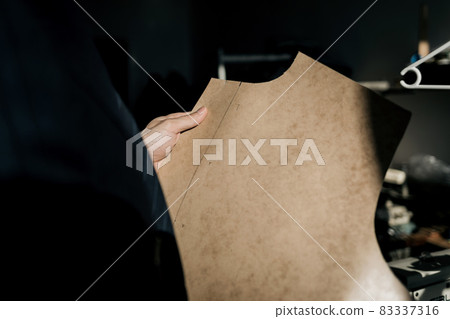 tailor works in the workshop 83337316