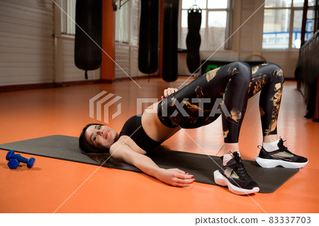 Young pretty woman training in gym. Heathy lifestyle, sport conception. Young pretty woman training in gym. Heathy lifestyle, sport conception. 83337703
