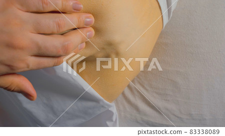 Fracture of the coccyx of spine. External medical exam by a doct 83338089
