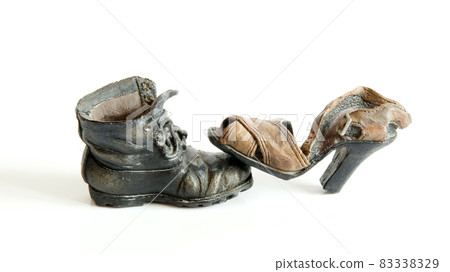 Old ceramic shoes isolated on white background Old ceramic shoes isolated on white background 83338329