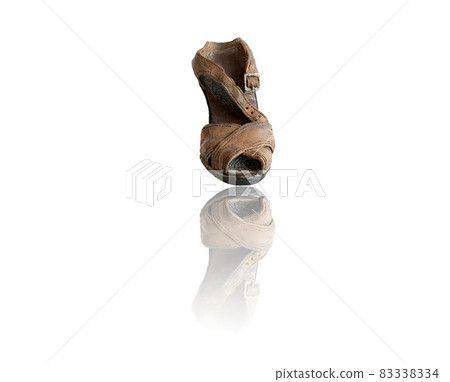 Old ceramic shoe with reflection, isolated on a white background 83338334