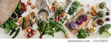 Female hands cutting ingredients for cooking over Female hands cutting ingredients for cooking over 83338855
