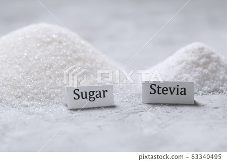 A pile of sugar and stevia sweetener with signatures A pile of sugar and stevia sweetener with signatures 83340495