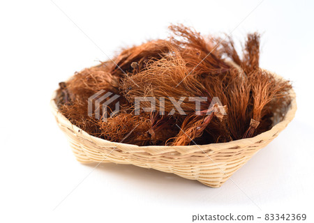Dry Bombax ceiba flower stamen in a bamboo basket on white background Dry Bombax ceiba flower stamen in a bamboo basket on white background 83342369