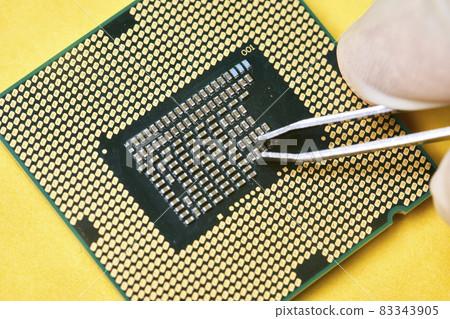 Macro-shot of computer microchip processor. Global chip and semiconductor shortage. Symbol of ongoing crisis in car industry. Concept of high demand for integrated circuits Macro-shot of computer microchip processor. Global chip and semiconductor shortage. Symbol of ongoing crisis in car industry. Concept of high demand for integrated circuits 83343905