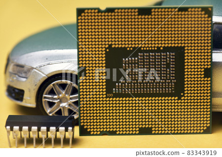 CPU chip and semiconductors with car toy. Global car chip shortage. Micro-chip shortage creates dearth of new cars. Computer chip shortage stalls car industry production 83343919