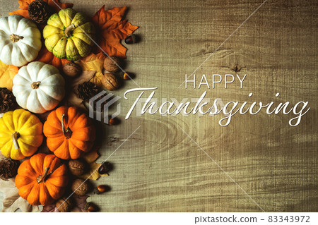 Happy Thanksgiving Day with pumpkin and nut on wooden table Happy Thanksgiving Day with pumpkin and nut on wooden table 83343972