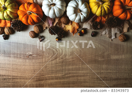 Happy Thanksgiving Day with pumpkin and nut on wooden table Happy Thanksgiving Day with pumpkin and nut on wooden table 83343973