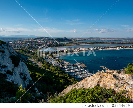 aerial view of the coast of the city of Cagliari, Sardinia Italy, and the piers with moored boats 83344609