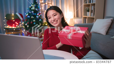 asian woman has video chat 83344787