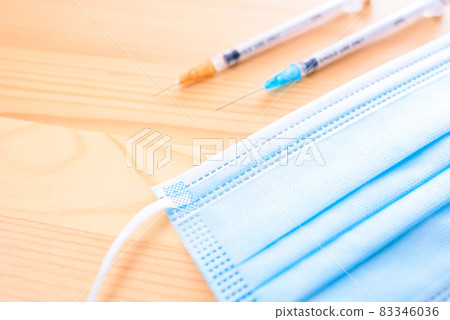 Syringe and surgical mask, prevention of new coronavirus infection in Japan, prevention of spread of infection, overcoming 83346036
