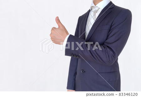A businessman who raises his thumb and makes a good pose A businessman who raises his thumb and makes a good pose 83346120