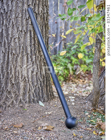 steel mace (or macebell) in a backyard steel mace (or macebell) in a backyard 83347461