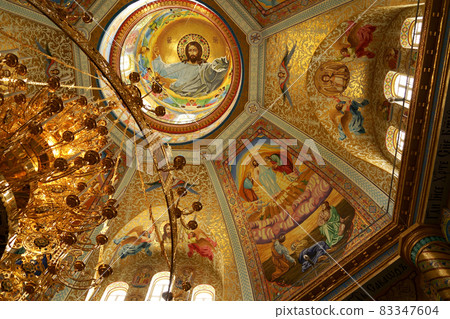 POCHAIV, UKRAINE -2021: Lavra Orthodox Christian Monastery Complex Transfiguration Cathedral Interior Cupola Ceiling Fresco of God Jesus Christ POCHAIV, UKRAINE -2021: Lavra Orthodox Christian Monastery Complex Transfiguration Cathedral Interior Cupola Ceiling Fresco of God Jesus Christ 83347604