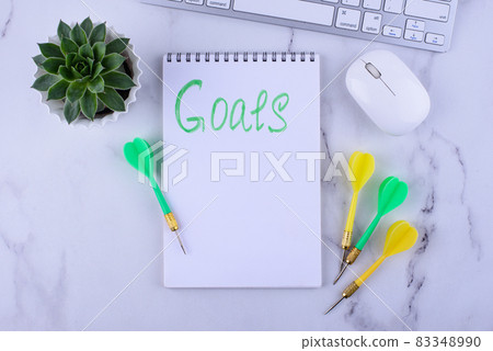 Target and goal concept with arrows and notebook Target and goal concept with arrows and notebook 83348990