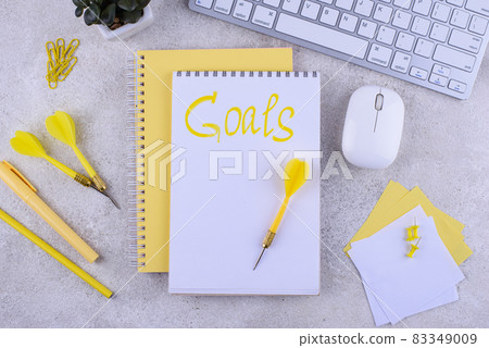 Target and goal concept with arrows and notebook Target and goal concept with arrows and notebook 83349009