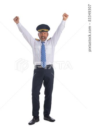 Airline pilot holds up his arms 83349307