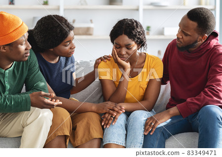 African american friends supporting upset young lady African american friends supporting upset young lady 83349471