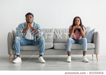 Young married black couple ignoring each other after having fight 83350458
