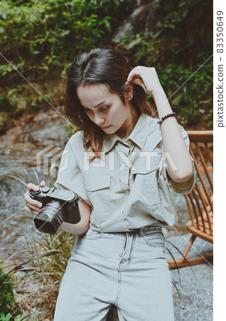 Series photo of young woman photographer with her camera shooting photo outdoor 83350649