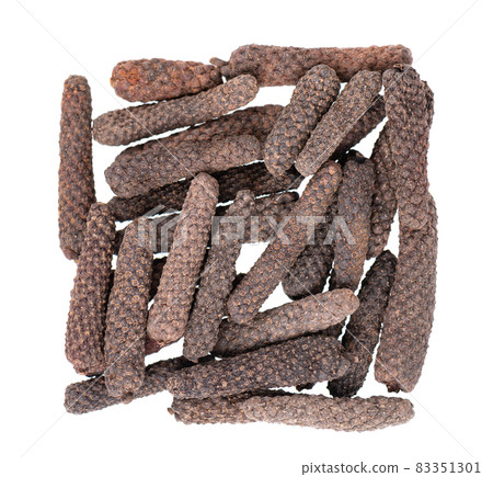 Long pepper isolated on white background. Heap of pippali or piper longum. Top view. Long pepper isolated on white background. Heap of pippali or piper longum. Top view. 83351301