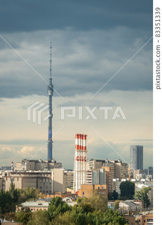 Ostankino Tower above Moscow cityscape in summer, Russia. Panorama of Moscow and TV tower on blue sky background. Moscow city skyline with Panoramic view of Moscow residential district Ostankino Tower above Moscow cityscape in summer, Russia. Panorama of Moscow and TV tower on blue sky background. Moscow city skyline with Panoramic view of Moscow residential district 83351339