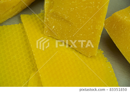 large pieces of natural beeswax, close-up, raw materials for candles. large pieces of natural beeswax, close-up, raw materials for candles. 83351850