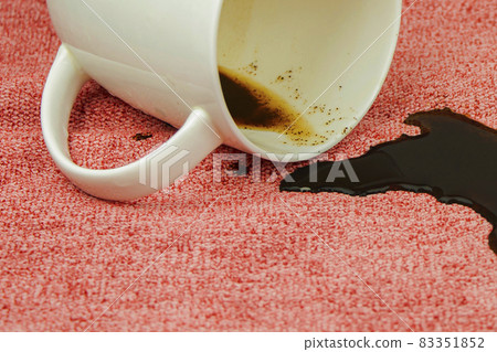 A spot on a light fabric, tablecloth, sofa. Washing, cleaning the fabric 83351852