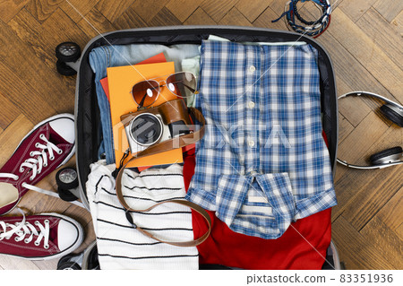 Suitcase preparation for travel 83351936