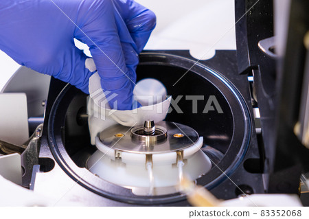 Cleaning of ion source of mass spectrometer by laboratory worker in rubber gloves. LC MS, liquid chromatography and daily routine  83352068
