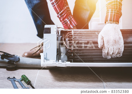 repairing the air conditioner repairing the air conditioner 83352380