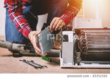 repairing the air conditioner repairing the air conditioner 83352382
