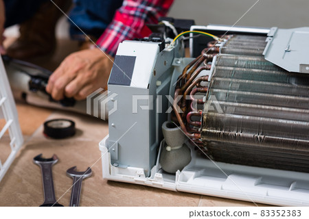 repairing the air conditioner repairing the air conditioner 83352383